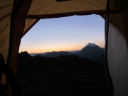 Watch sunrise from inside the tent in the mountains